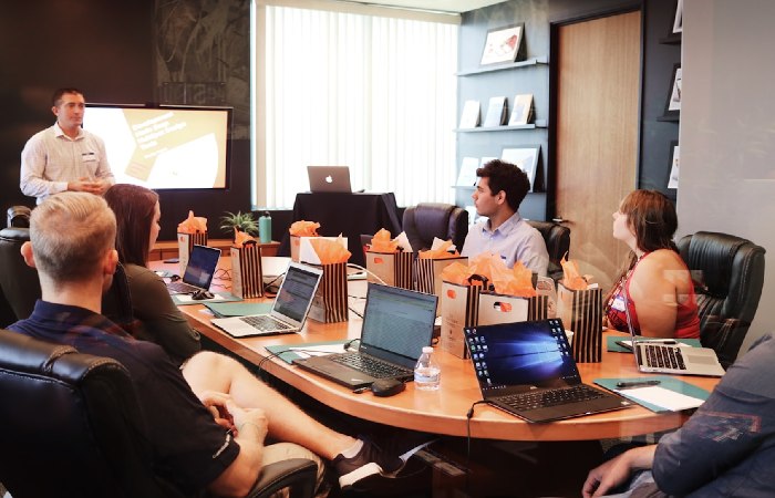 a team in an office discussing account management during a meeting